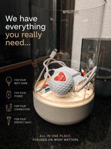a poster of a golf ball on a table at Chalet Beyond in Veľká Lomnica