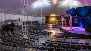 an auditorium with chairs and a stage at night at Rio Quente Resorts - Eco Chalés in Rio Quente +59 photos