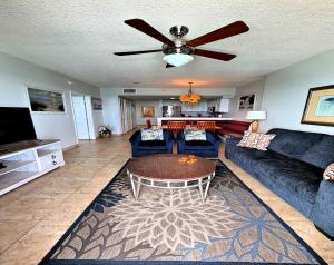a living room with a couch and a table at Wyndham Ocean Walk 2 BR Resort Condo Direct Oceanfront - Daytona Funland 22260 in Daytona Beach