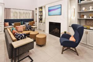 a living room with a couch and a fireplace at Hampton Inn & Suites Lanett/West Point in Lanett