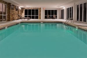 a swimming pool with blue water in a house at Hampton Inn & Suites Lanett/West Point in Lanett