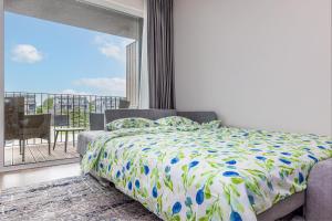 a bedroom with a bed and a balcony at Baltic Cozy Spot in Palanga +14 photos