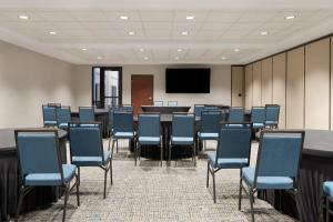 a conference room with chairs and a table and a screen at Hampton Inn & Suites Boise-Meridian in Meridian +92 photos
