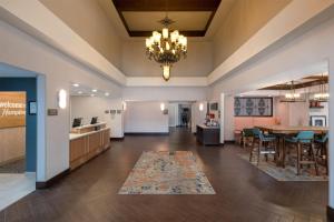 a large living room with a dining room and a kitchen at Hampton Inn & Suites Fresno in Fresno