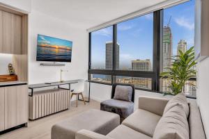 a living room with a couch and a large window at Beautiful Miami Apt Pool & Beach for 3 Guests in Miami