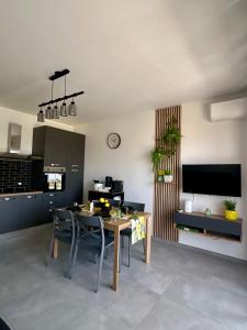 a kitchen and dining room with a table and chairs at U Zu Ciccio in Terrasini