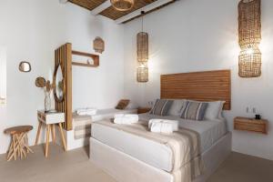 a bedroom with a large bed with a wooden headboard at EOS Gaeta in Gaeta