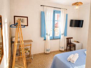 a room with a ladder and a bed and a window at Paradice in Baunei in Baunei