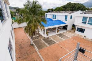 an overhead view of a building with a palm tree at Casa Serena Hotel Boutique in Melgar