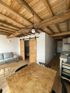 a dining room with a table and a couch at Alcacer 4 - 2 in Puentedeume