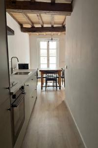 a kitchen with a table and a dining room at Alcacer 4 - 2 in Puentedeume +24 photos