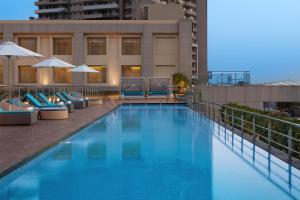 a swimming pool on top of a building at DoubleTree by Hilton Agra in Agra