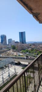 a view of a city from a balcony at tamzain24 in Marseille