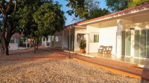 a house with a courtyard in front of it at Acaymas Club in Ricaurte