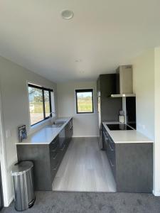 a kitchen with a sink and a counter top at Blacksmith's Rest in New Plymouth