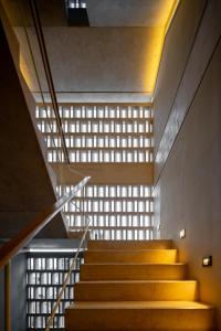 a staircase with a light shining through a window at Donceles Plaza in Cancún +6 photos