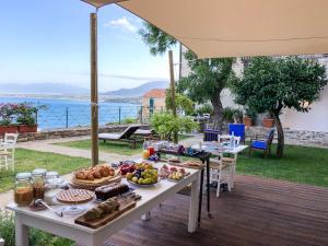a table with food on it on a deck at Donna Clara in Agropoli