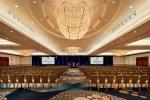 a conference room with chairs and a chandelier at Hilton Austin in Austin +69 photos