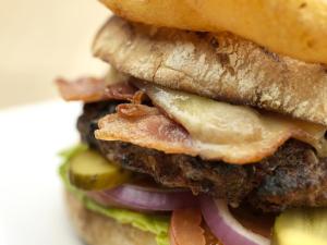 a close up of a sandwich with meat and vegetables at Hilton Garden Inn Birmingham Brindley Place in Birmingham +58 photos