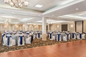 a banquet hall with tables and chairs in a room at Hampton Inn Burlington - Colchester in Burlington +33 photos