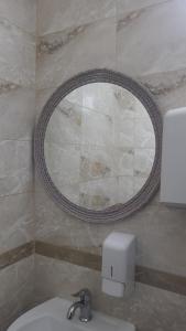 a bathroom with a sink and a mirror on the wall at Villa art colony in Ohrid +39 photos