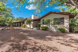 a house with a playground in front of it at Sedona Spacious 2BR Desert Escape in Sedona