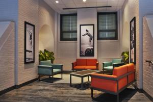 a waiting room with colorful chairs and pictures on the wall at The Palmer House Hilton in Chicago