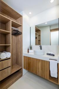 a bathroom with a sink and a mirror at Mono Luxe Villas in Tamarindo +26 photos
