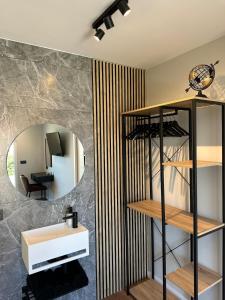 a bathroom with a sink and a mirror at Brisa de Sálvora in Ribeira +40 photos