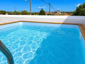 a swimming pool on the roof of a house at Casa das Lages in Pedrógão