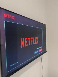 a television screen with the netflix sign on it at Stylish 1BR Apartment Close to City Center Liège in Liège