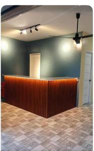 a waiting room with a red partition and a green wall at Peipers Inn in Panglao Island +1 photo