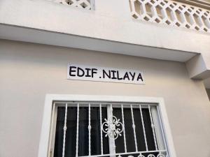 a street sign on the side of a building at Residencia Nilaya in Las Terrenas