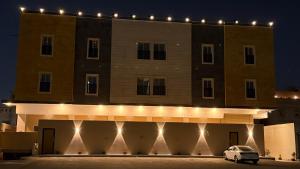 a building with a car parked in front of it at شقق المشرق in Jeddah