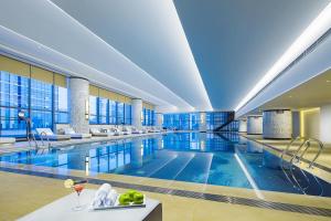 a large swimming pool in a hotel room at Hilton Zhuzhou in Zhuzhou