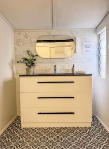 a kitchen with a sink and a counter at Panacea Rising in Yeppoon +52 photos