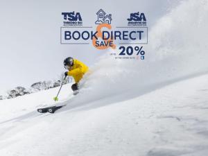 a person skiing down a snow covered slope at Squatters Run 14 in Thredbo +6 photos