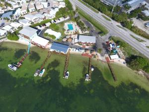 an aerial view of a resort with cars parked on a island at Edgewater Lodge in Layton