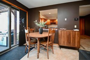 a dining room with a wooden table and chairs at FC River Retreat in Wilson +28 photos