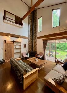 a living room with a couch and a table at The Blue Moon in Nasushiobara