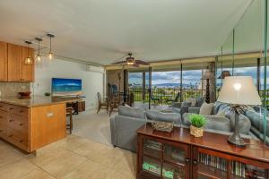 a living room with a couch and a table at Kihei Alii Kai Ocean View Condo Pool, Hot Tub, Sauna, AC, Sleeps 4 in Kihei +28 photos
