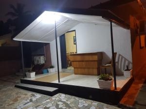 a white tent in a room with potted plants at 2 CHAMBRES SALON MEUBLé in Yamoussoukro +3 photos