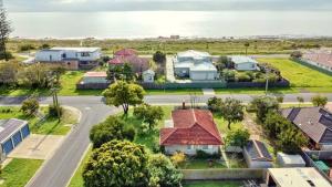an aerial view of a suburb with houses and the ocean at Family Beachside Shack in Geographe