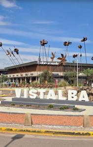 a large sign in front of a large building at La Delfina in Chacras de Coria