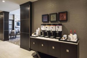 a room with a counter with bottles of wine at Hampton Inn & Suites Bridgewater, NJ in Bridgewater