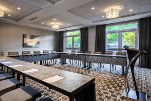 a conference room with rows of tables and chairs at Hampton Inn & Suites Bridgewater, NJ in Bridgewater +36 photos
