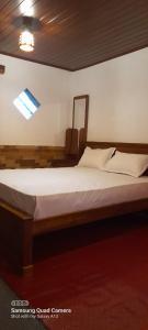 a large bed in a room with at Himidiri Villa in Nuwara Eliya