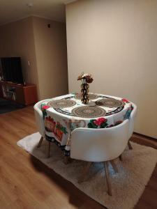 a table and a bath tub sitting in a room at Depa en Comas in Lima
