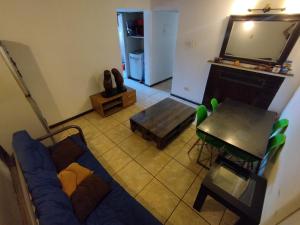 a living room with a couch and a table at Habitación Doble en Dpto compartido in Santiago