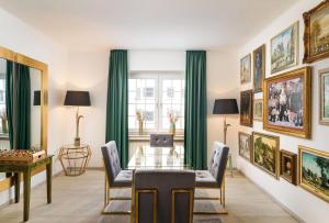 a dining room with a glass table and chairs at Arthotel ANA Liberty, Trademark Collection by Wyndham in Bremen